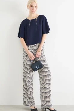 Pantalone dalla linea morbida a pois - Bianco Nero